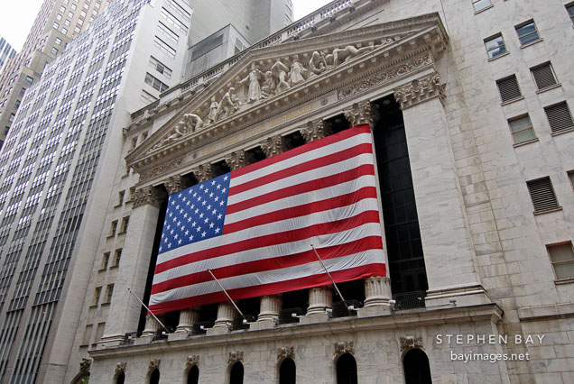 New York Stock Exchange and American flag. New York City, New York, USA.