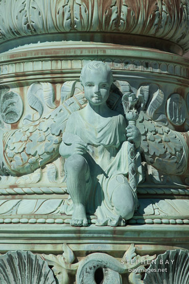 Cherub with feather quill and scepter. Supreme Court flag pole, Washington, D.C.