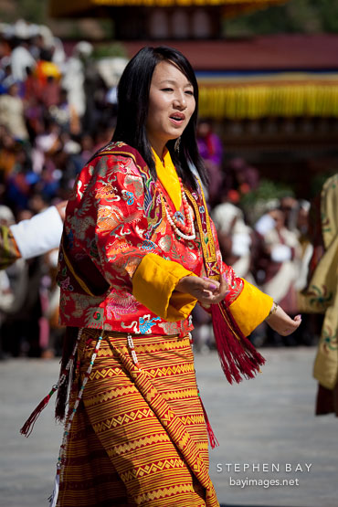 Woman folk dancer from the Royal Academy of Performing Arts. Thimphu tsechu, Bhutan.