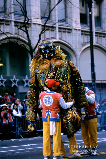 Adjusting the costume. San Francisco Chinese New Year Parade. San Francisco, California.
