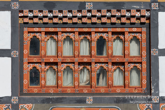 Windows in the distinctive Bhutanese architectural style. Thimphu, Bhutan.