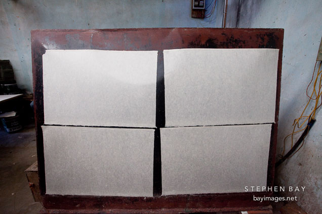 Drying four large handmade sheets of paper. Jungshi paper factory, Thimphu, Bhutan.