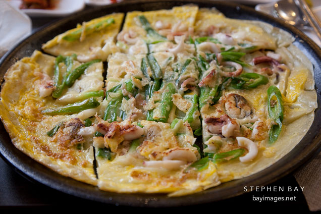 Haemul pajeon (seafood pancake) with green onions is a popular Korean dish.