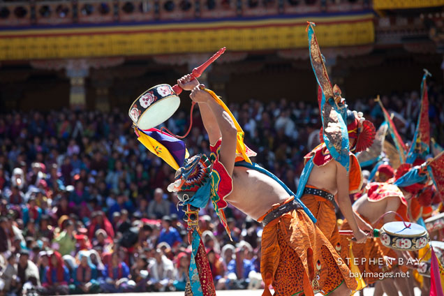 Ging dancer beating drums. Thimphu tsechu, Bhutan.