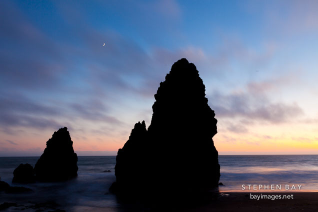 Moon and seastacks at Rodeo Beach. Marin County, California.