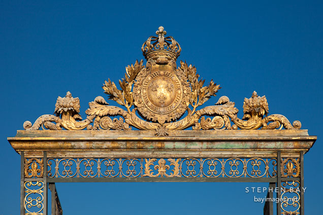 Ornate gate at the Palace of Versailles. Versailles, France.