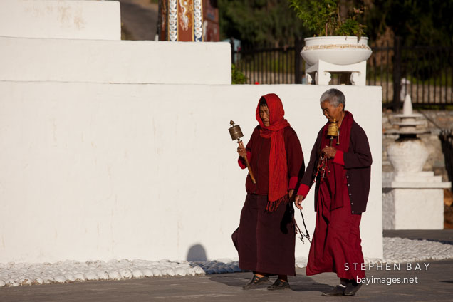 Buddhist nuns walk clockwise around the National Memorial Chorten. Thimphu, Bhutan.