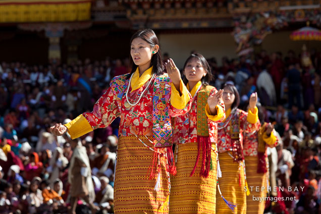 Women from the Royal Academy of Performing Arts in a traditional folk dance. Thimphu tsechu, Bhutan.