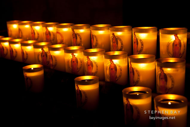 Candles inside Notre Dame Cathedral. Paris, France.