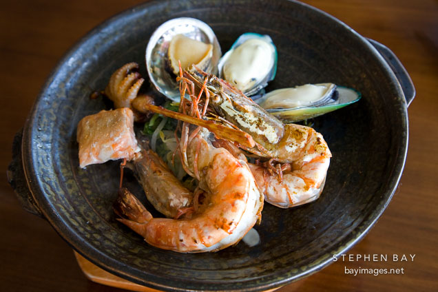 Korean seafood dish with shrimp, oysters, abalone, molluscs, octopus, and salmon.