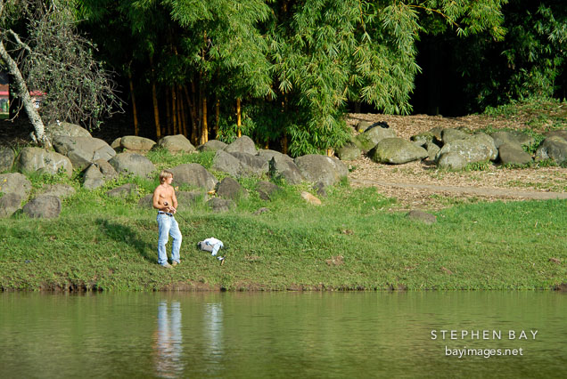 Man fishing in the La Sabana Park. San Jose, Costa Rica.