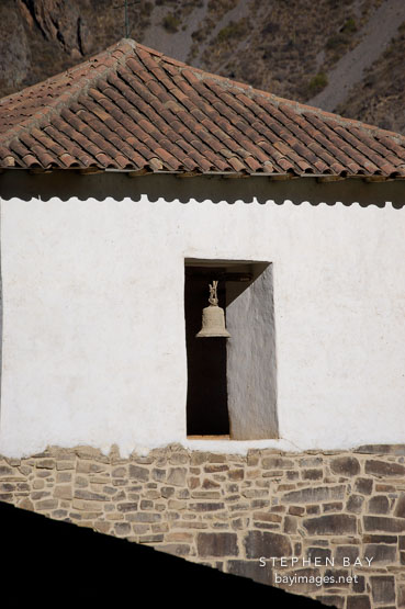 Bell in window at Ollantaytambo. Sacred Valley, Peru.
