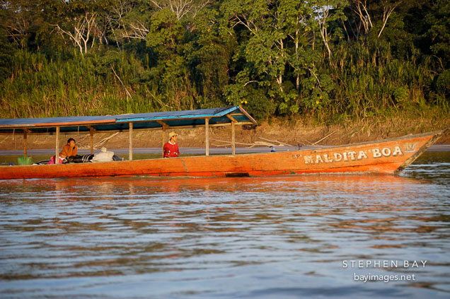 Boat traveling on the Madre de Dios river. Amazon, Peru.