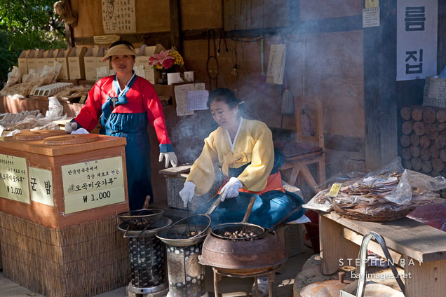 These women are making gun bam, or roast chestnuts at the Korean Folk Village.