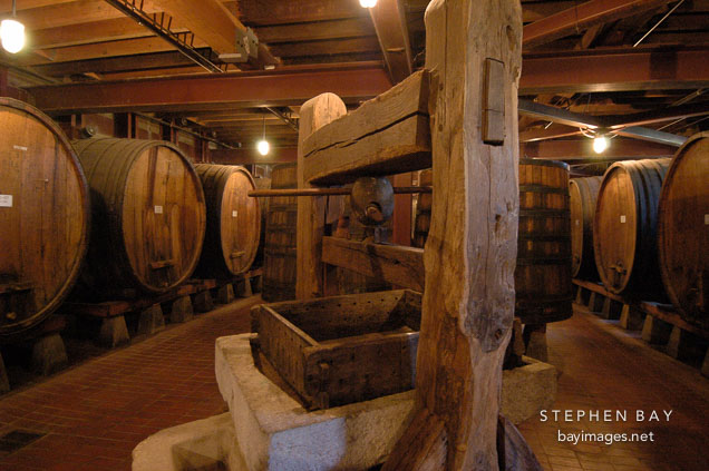 Wine press and giant barrels. Napa Valley, California, USA.