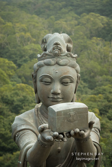 Buddhist statues praising the Tian Tan Budha. Lantau Island, Hong Kong, China.
