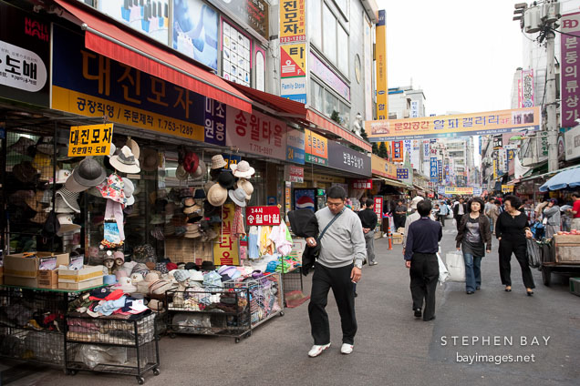 The Namdaemun Market in Seoul is nearly always packed with shoppers. In addition to the hats pictured here, the market offers thousands of other items.