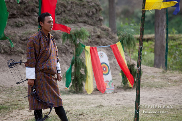 Archer wearing gho. Punakha, Bhutan.