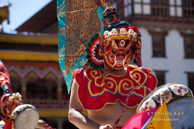 Ging dancer with a flag attached to their head. Thimphu tsechu, Bhutan.