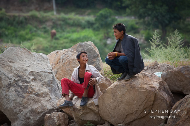 Two boys watching the archery competition at Punakha Dzong.