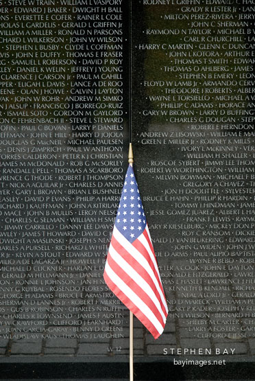 American flag at the Vietnam Veteran's Memorial Wall. Washington, D.C., USA.