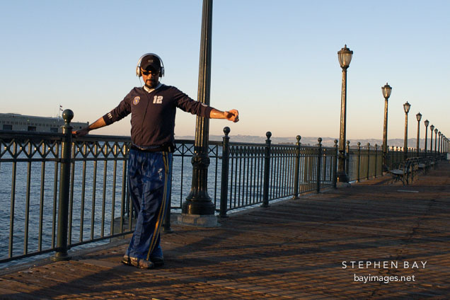 Man stretching at Pier 7, San Francisco, California.