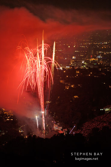Fireworks at the Hollywood bowl seen from Mulholland Drive. Los Angeles, California, USA.