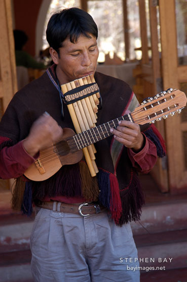 Musician playing the zampona and charango. Sacred Valley, Peru.