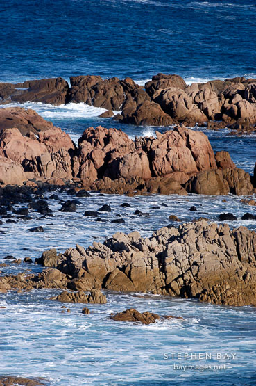 Waves crashing over costal rocks. Pyramid rock, Philip Island, Australia.