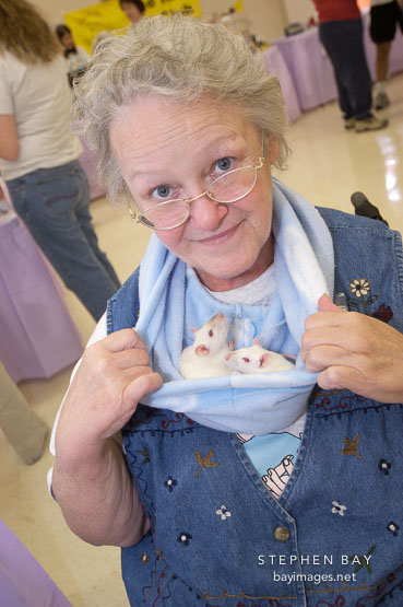 Barbara Henderson shows off two Himalayan rats in her neck pouch. The Wonderful World of Rats, San Mateo, California.