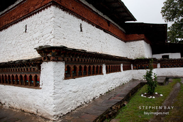 Prayer wheels line the walls of Kyichu Lhakhang. Paro, Bhutan.