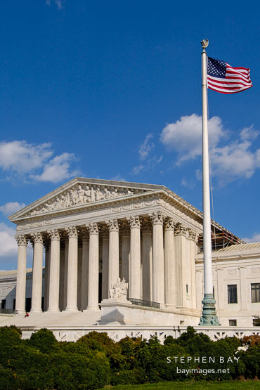 The U.S. Supreme Court and American flag. Washington, D.C., USA.