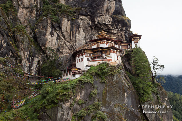 Sheer cliff walls and the Tiger's Nest monastery. Paro Valley, Bhutan.