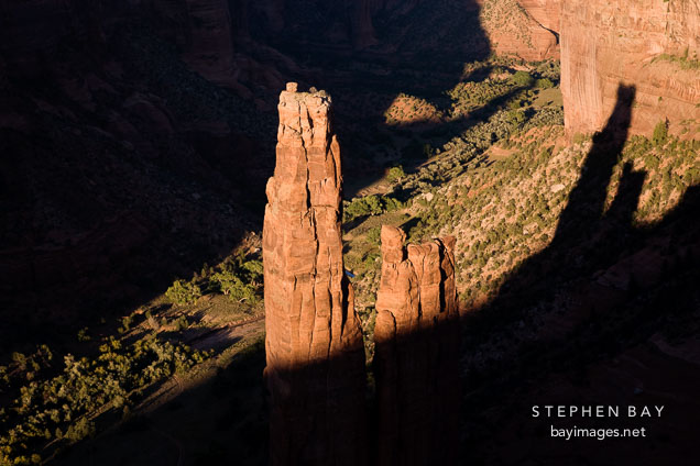 Spider Rock and long shadows cast by the canyon walls. Canyon de Chelly, Arizona.