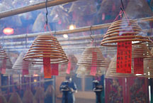 Man Mo Temple is filled with smoke from burning incense. Hong Kong, China - Photo #15110