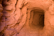 Tunnel though the sandstone rock. White House Ruin Trail, Canyon de Chelly. - Photo #18214