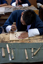 Student carving wood block at the National Institute for Zorig Chusum. Thimphu, Bhutan. - Photo #22915