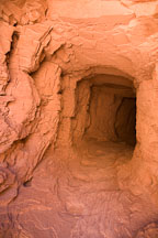 The White House Ruin Trail goes through a sandstone tunnel. Canyon de Chelly, Arizona. - Photo #18215