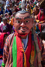 A clown (atsara) moves through the audience to collect donations. Thimphu tsechu, Bhutan. - Photo #22617