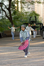 Woman with fan. Kowloon Park, Hong Kong, China. - Photo #14719