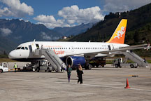 Drukair plane on the runway of the Paro airport. Paro, Bhutan. - Photo #22322