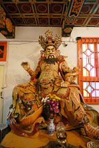 West deva-king holding a pearl and dragon. Welto Temple, Po Lin Monastery, Hong Kong, China. - Photo #16123