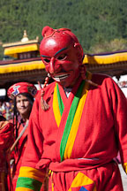 Clown (atsara) wearing bright red mask. Thimphu tsechu, Bhutan. - Photo #22424