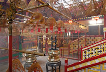 Incense coils hang from poles stretched across the temple. Man Mo Temple, Hong Kong, China. - Photo #15125