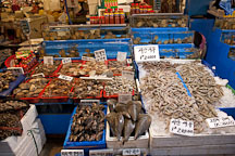 An overflowing stall awaits shoppers at the Noryangjin Fish Market in Seoul. - Photo #21225