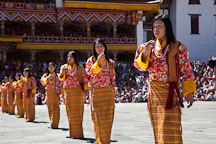 Row of female folk dancers. Thimphu tsechu, Bhutan. - Photo #22525