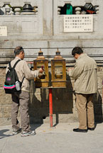 Two men lighting incense at the Wong Tai Sin Temple. Hong Kong, China. - Photo #15825