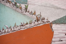 Broken bottles on top of wall surrounding a residence. Miraflores, Lima, Peru. - Photo #8703