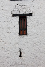 Arrow slit and window at Rinpung Dzong. Paro, Bhutan. - Photo #24031