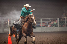 Man shooting targets at the Cowboy mounted shooting contest. Iowa State Fair, Des Moines. - Photo #33033